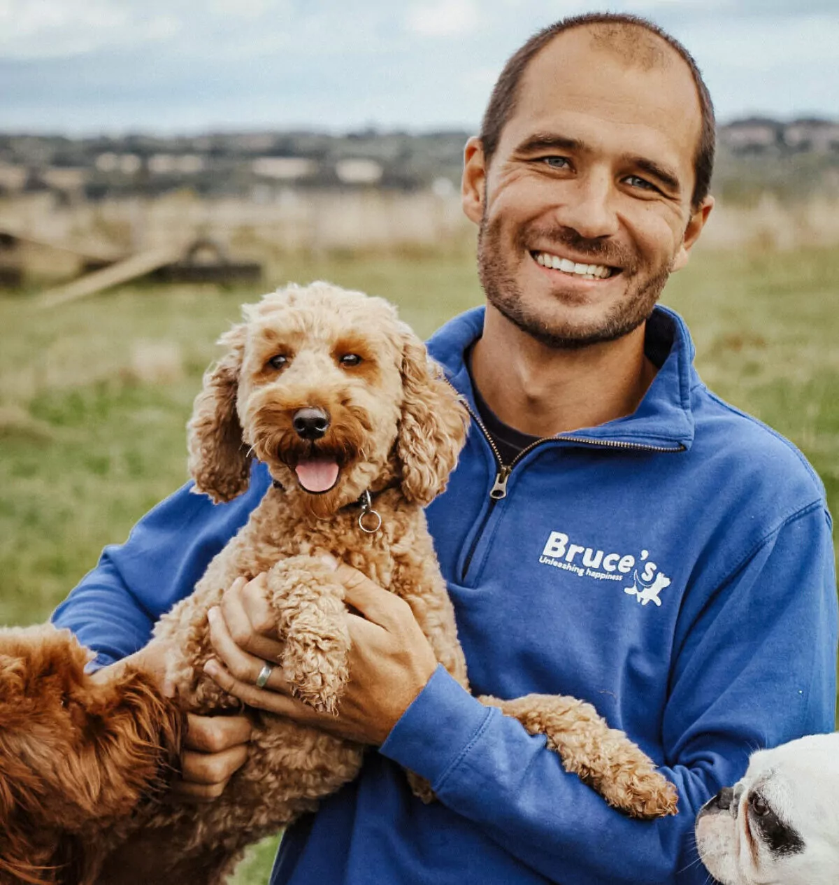 Bruce Casalis, Bruce's Doggy Day Care CEO and Founder with a cute dog